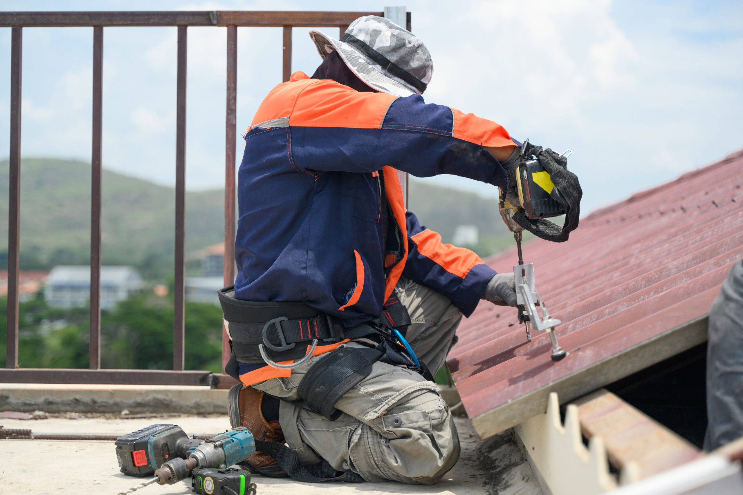 Professional engineer worker installing solar panels system on rooftop, Clean energy sources, Concept of alternative and renewable energy, Environment and technology concept