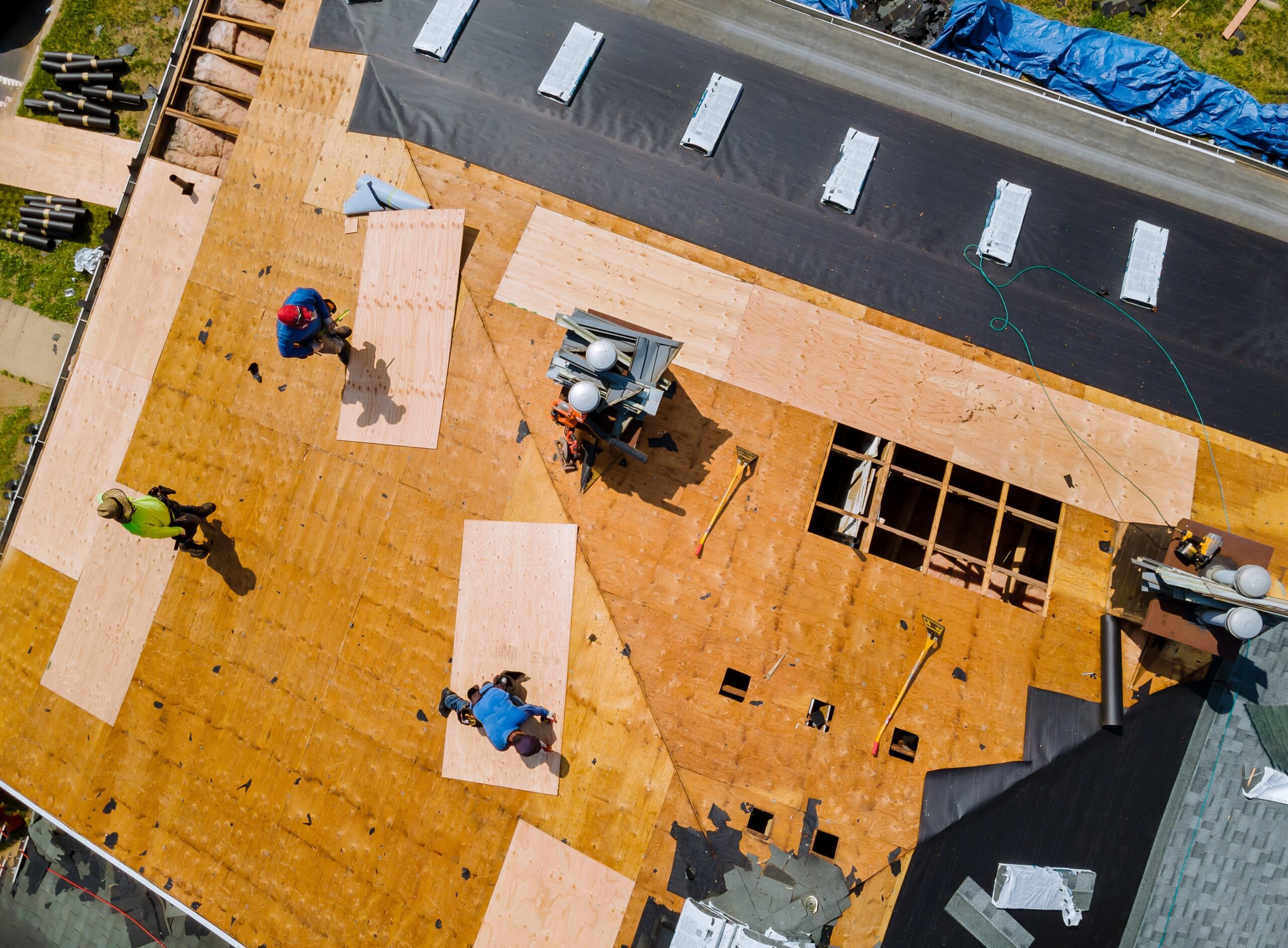 Removal of old roof replacement with new shingles of an apartment building