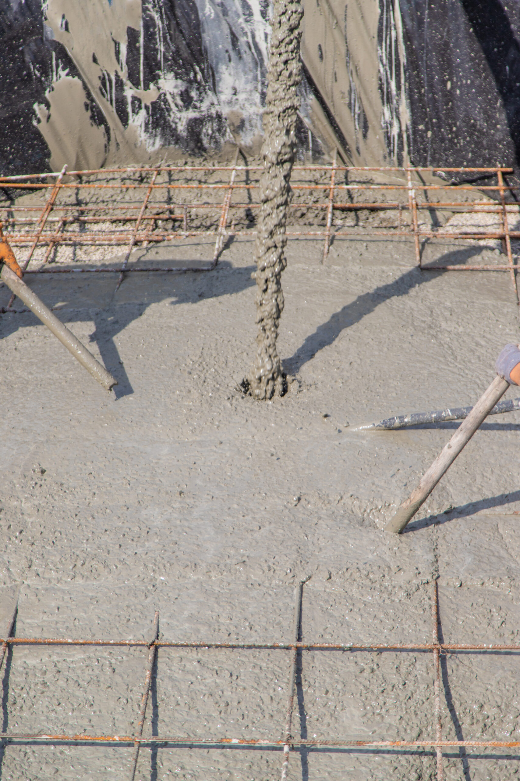 Pouring concrete monolith from a machine. Selective focus. work.